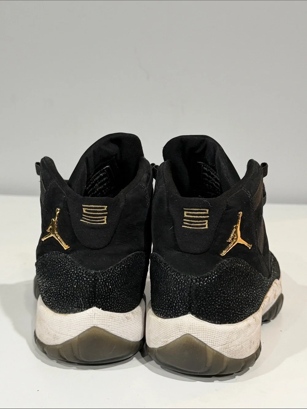 Jordan Black and Gold High-Top Sneakers